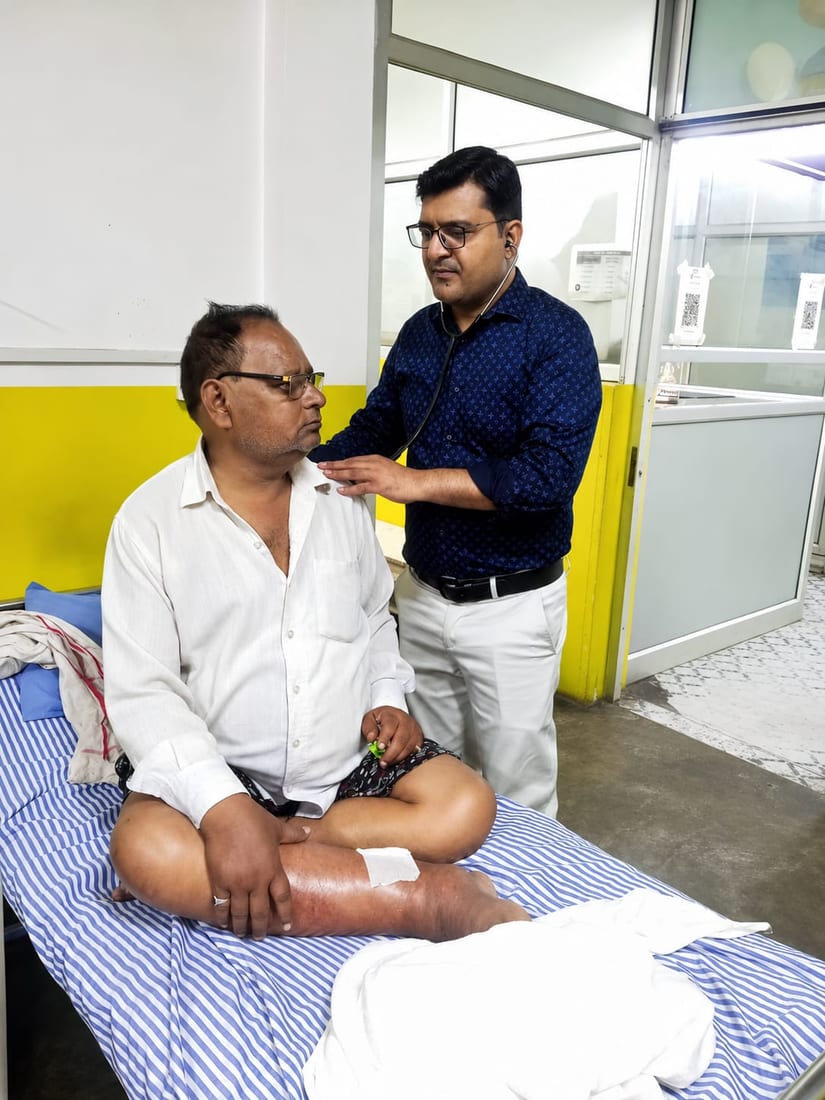 Dr. Alok Sachan examining a patient